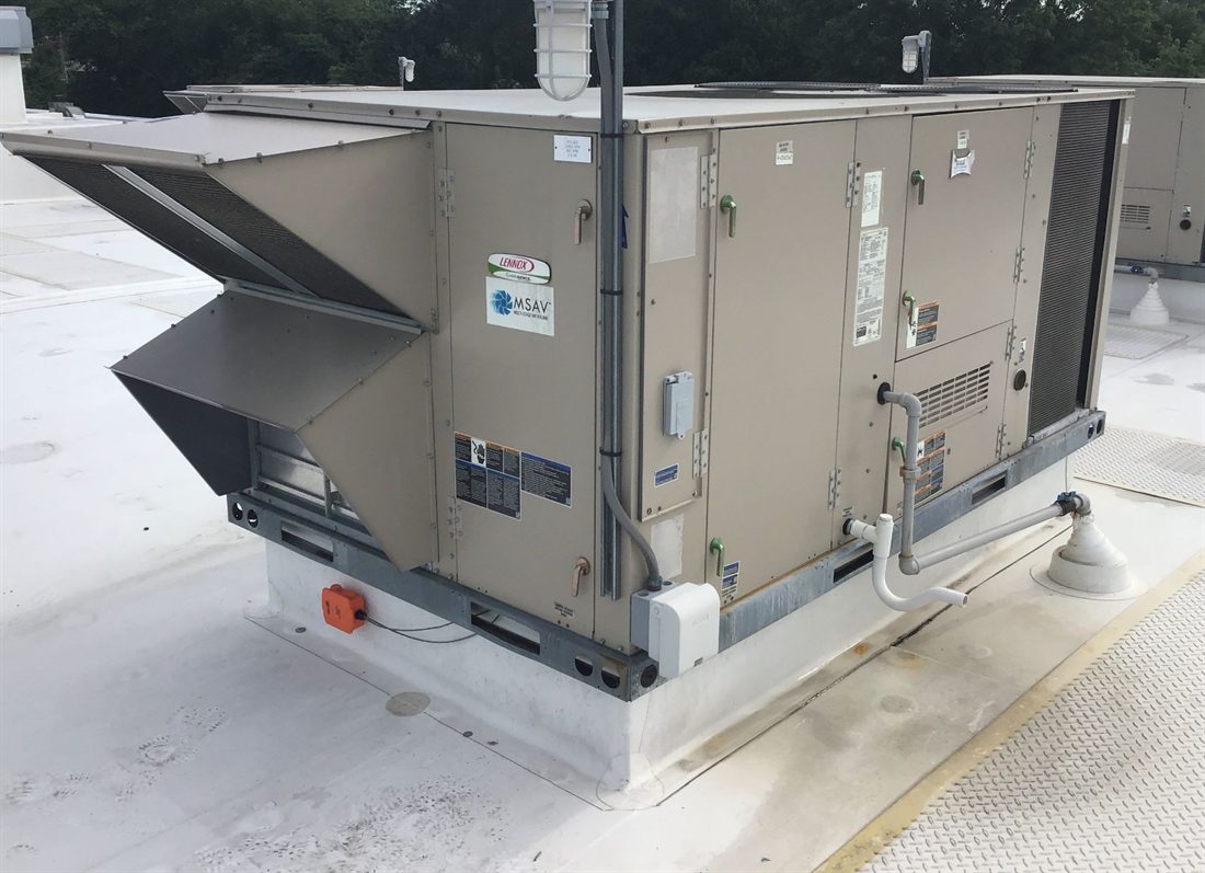 Commercial rooftop unit serviced by 512 Mechanical on a white TPO roof in Austin, Texas